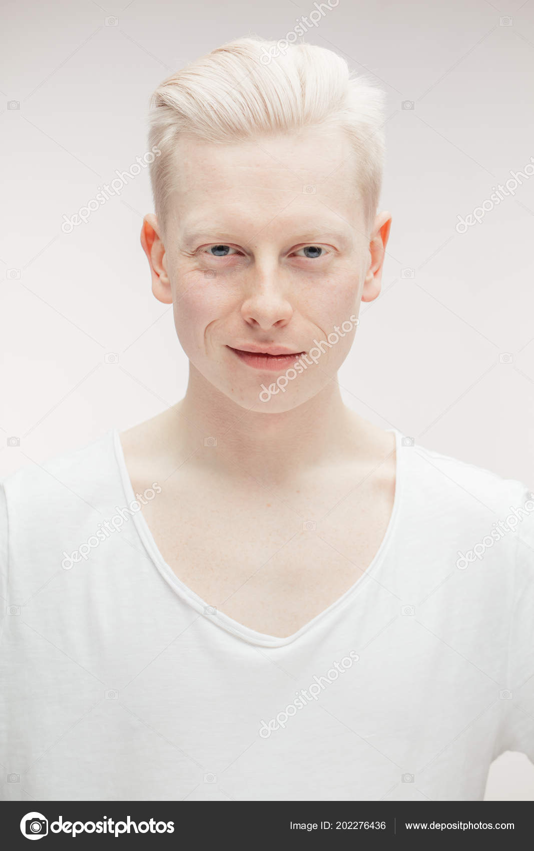 Fashion model male isolated on white. Handsome albino guy 