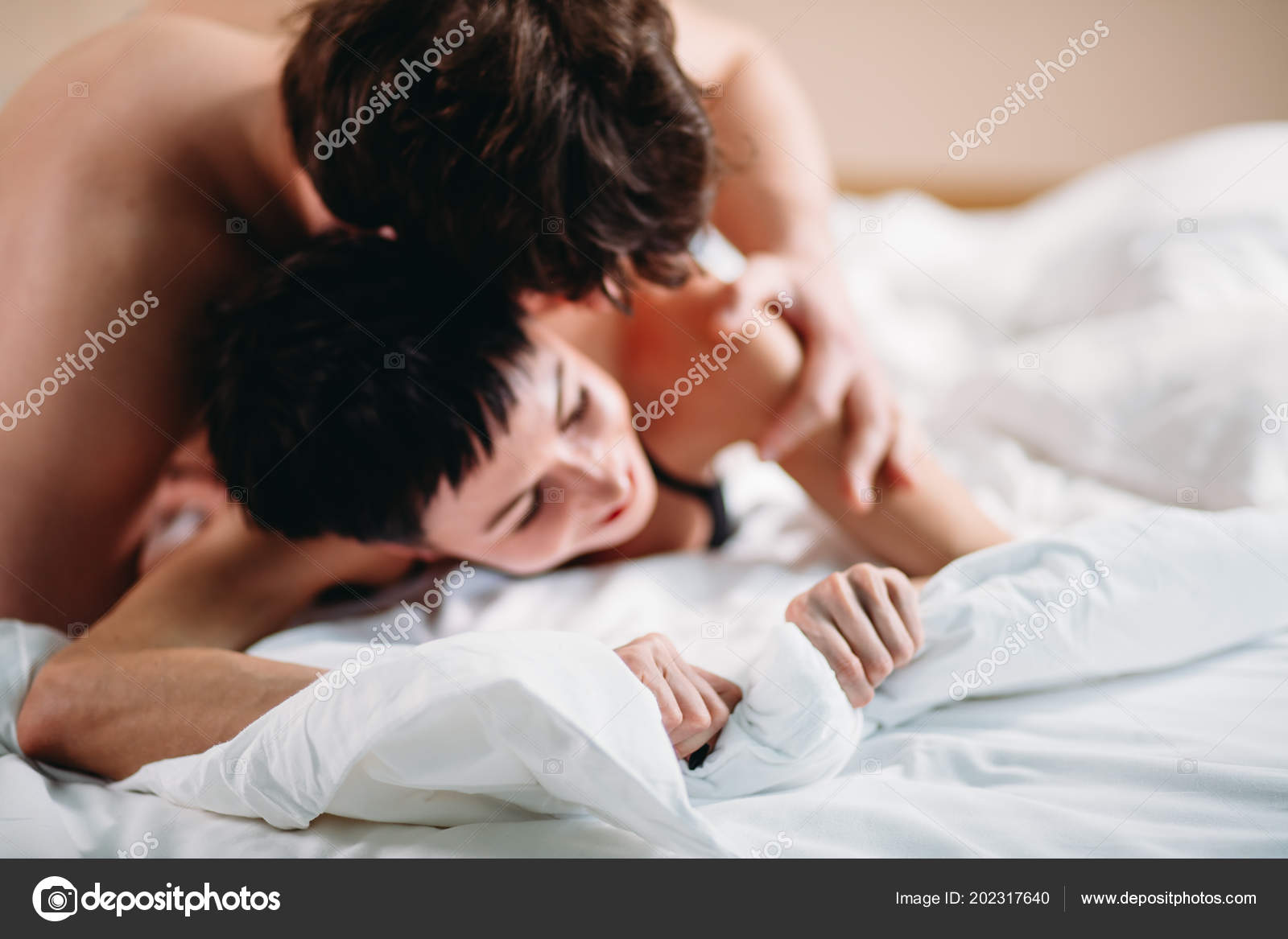 Close up hands of a couple having hot sex on a bed Stock Photo by ©ufabizphoto 202317640