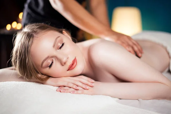 Beautiful, young and healthy woman is having hot stone massage. Spa Treatment — Stock Photo, Image