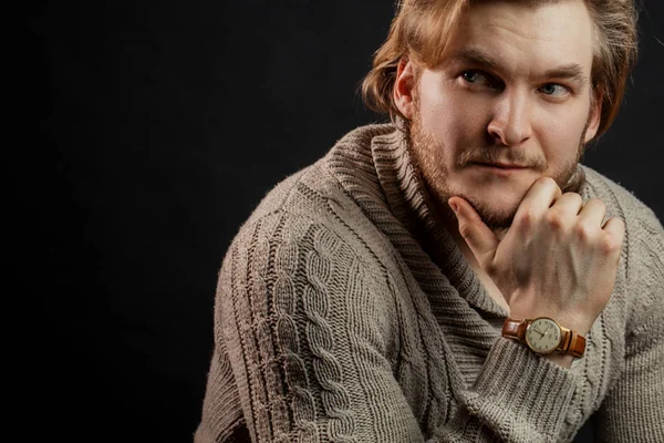 close up portrait of blond guy thinking about something