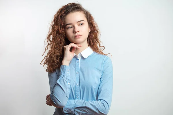 Portrait of young redhead girl with pensive serious look — Stock Photo, Image