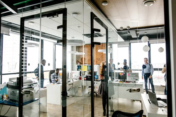 modern bright small office with glass walls, glass door, panorama window