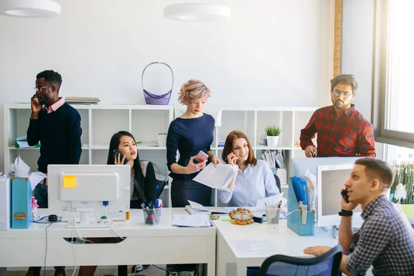 Beautiful young people working in a call center — Stock Photo, Image