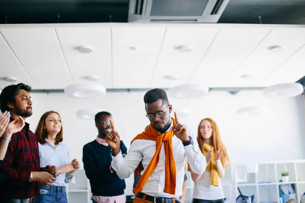 closeup portrait of a dance of triumph of African employee