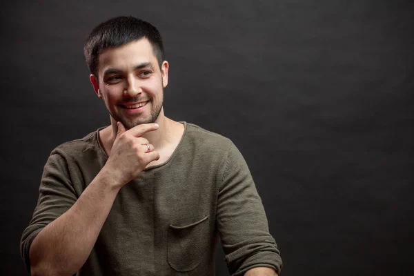 Close up portrait of a good-looking joyful man touching his chin. copyspace — Stock Photo, Image