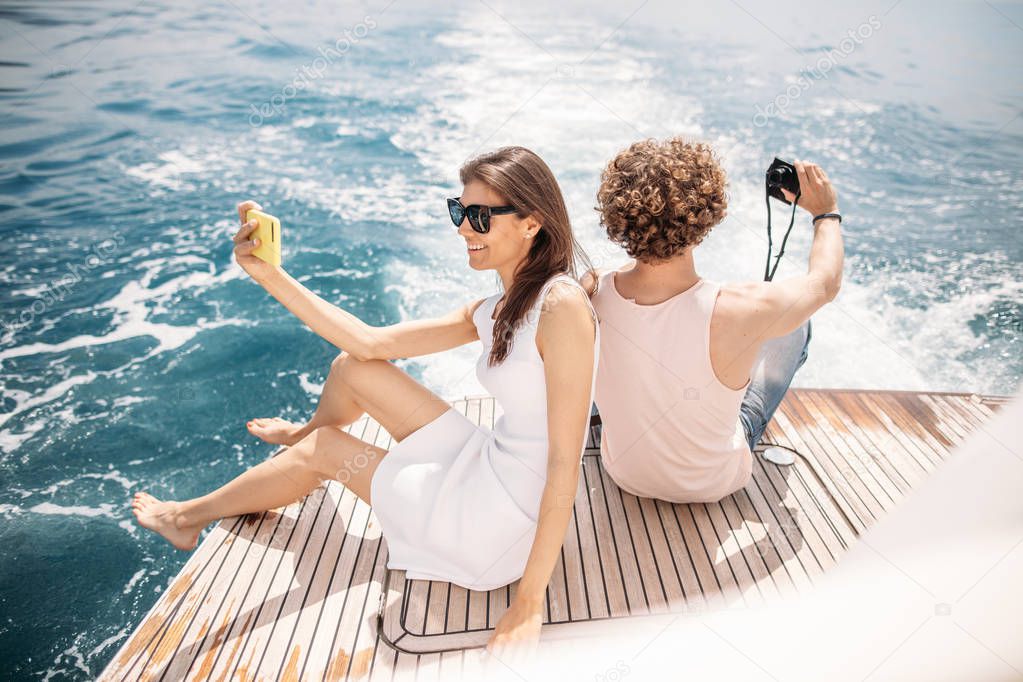 Happy caucasian couple taking selfie traveling on vacation