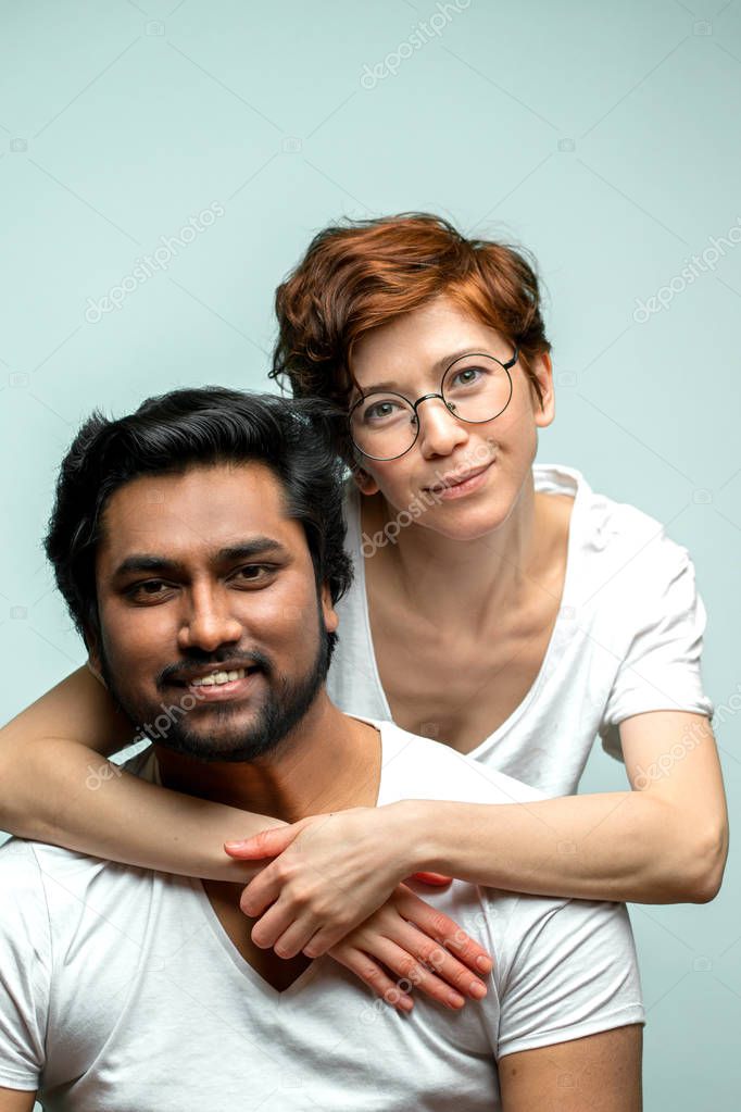 two mixed race friends posing to the camera