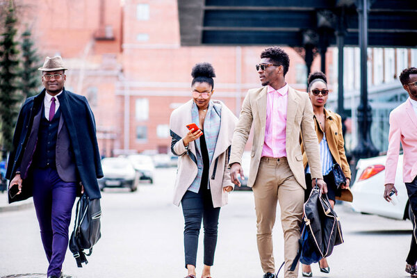 nice woman is chatting online in the crowded street
