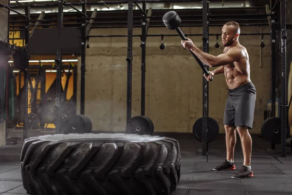 brutal sportsman is looking at the tire after hitting