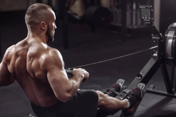 Close up photo. back view shot. athlete is rowing in the club — Stock Photo, Image