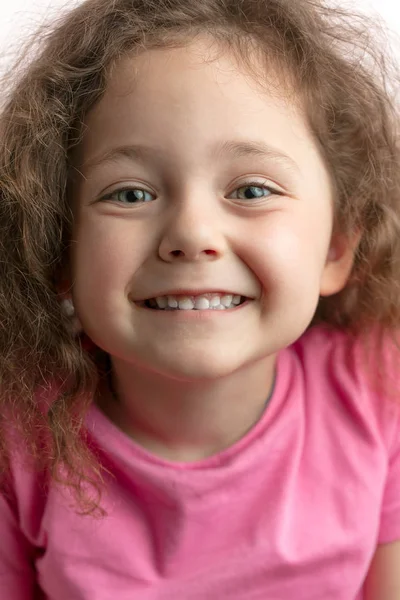 gorgeous kid showing her white teeth