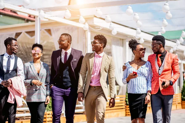 Positive african designers are going to the attend fashion presentation — Stock Photo, Image