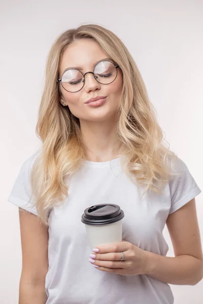 Pleasant female is enjoying drinking coffe beverage — Stock Photo, Image