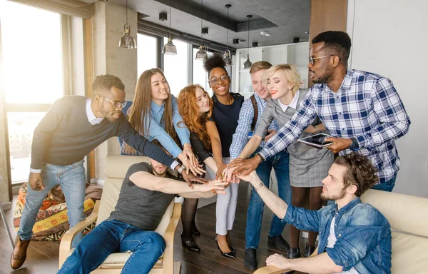 United multi ethnic youth putting hands together — Stock Photo, Image