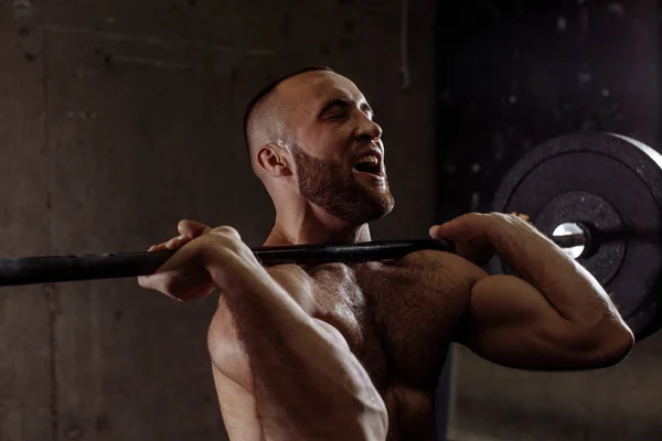 Happy fitness muscular man working out at gym — Stock Photo, Image