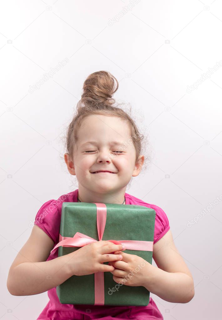 red-haired happy girl adores her gift box