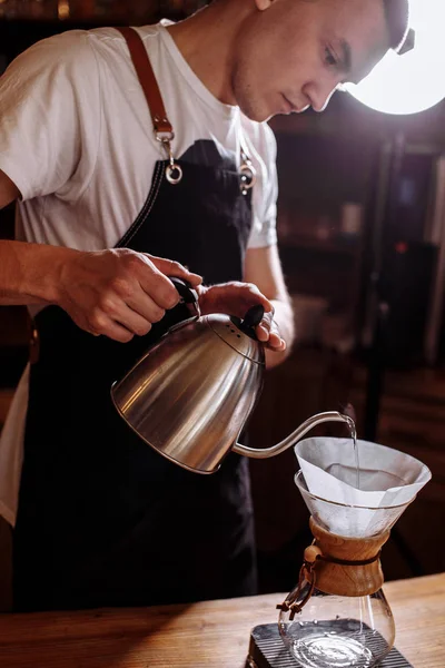 Male is adding hot water to coffee — Stock Photo, Image