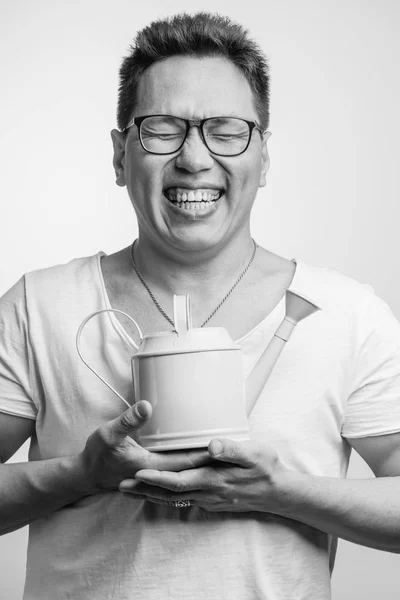 Happy funny Asian man in his 30s in white usual t-shirt with different positive emotions — Stock Photo, Image
