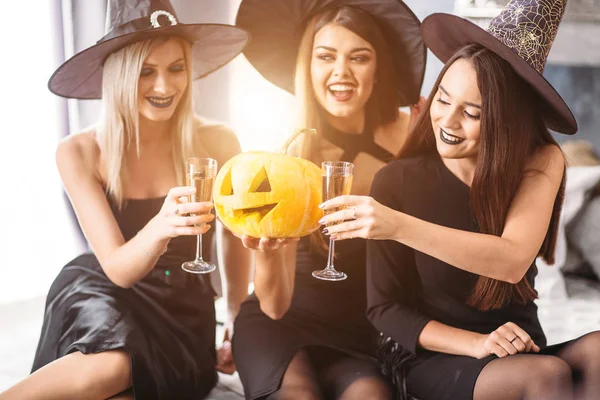 Three Friends Sit Bed Drink Champagne Halloween Party — Stock Photo, Image