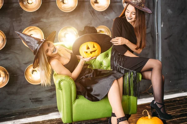 Two Happy Young Women Black Witch Halloween Costumes Party Sitting — Stock Photo, Image