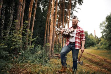 Bearded Man with firewoods and with axe on shoulder clipart