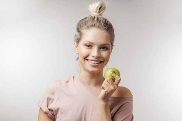 Beautiful young caucasian woman with blonde hair, isolated over white background