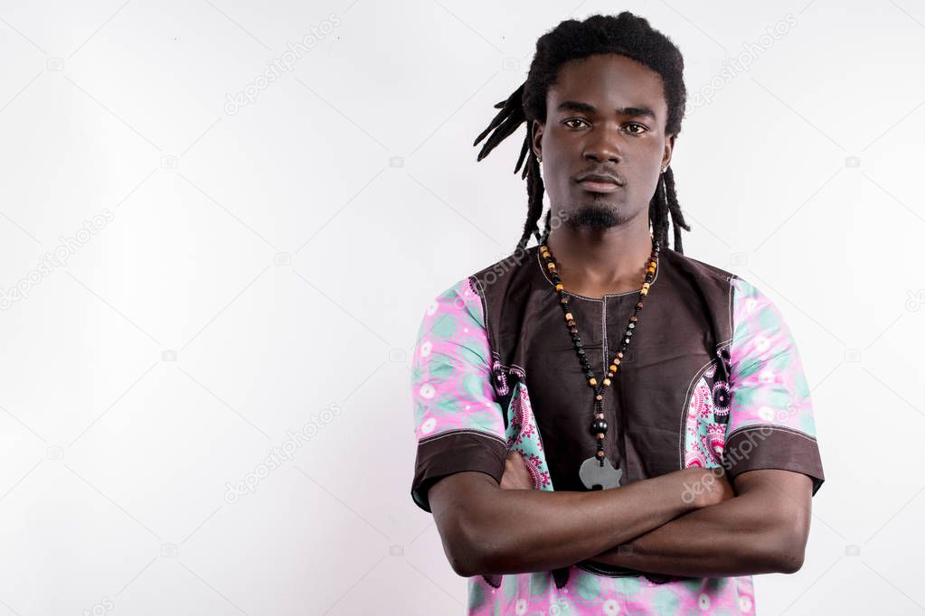 black man with dreadlocks in traditional colorful cloth