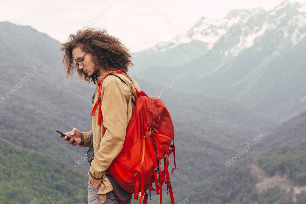 the Man Traveler with backpack hiking outdoor