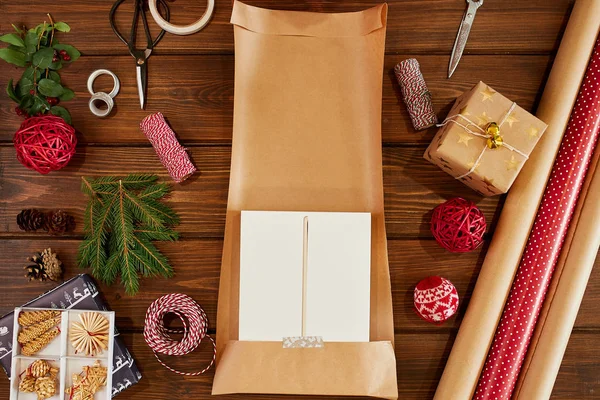 Handcrafted and ecological Christmas package. Flat lay of New year DIY packing.