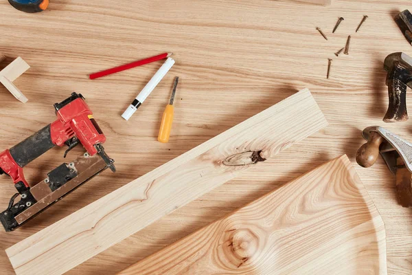 Set of carpenter s tools on wooden background, flat ray — Stock Photo, Image