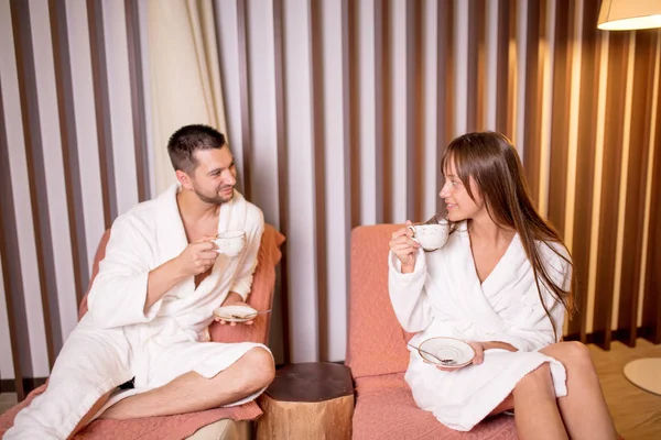 Nice to meet you. loving couple drinking tea in the spa salon