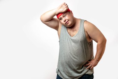 Overweight man tired after training, with hand on forehead against white clipart