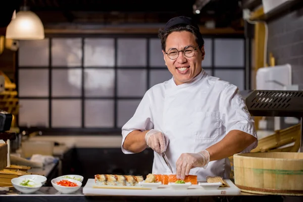 laughing Asian chef loves his job