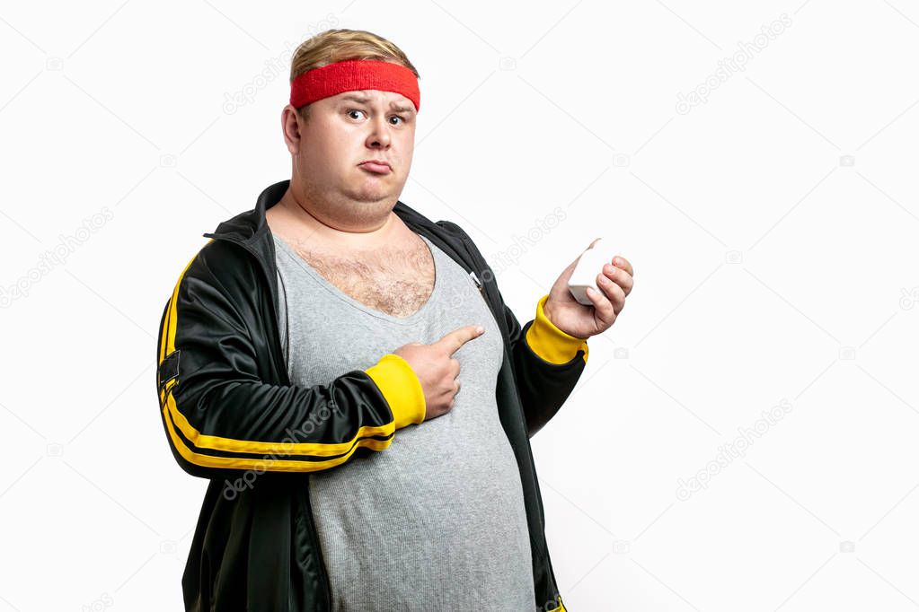 a fat man with pills in hand. Vitamins or Diabet Concept