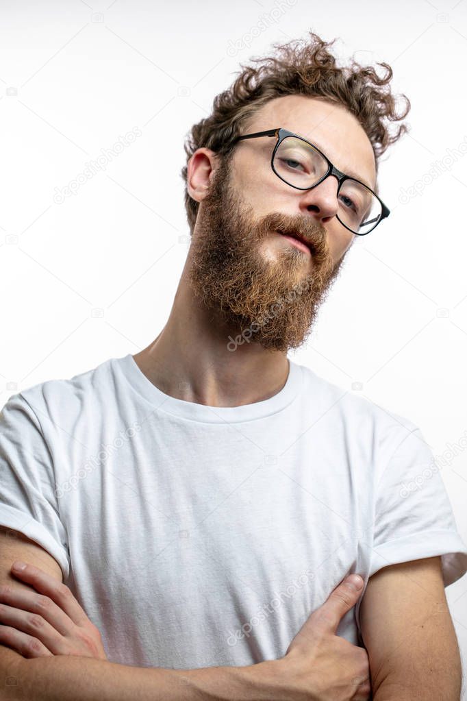 Mid - aged proud satisfied man with crossed arms looking at camera.