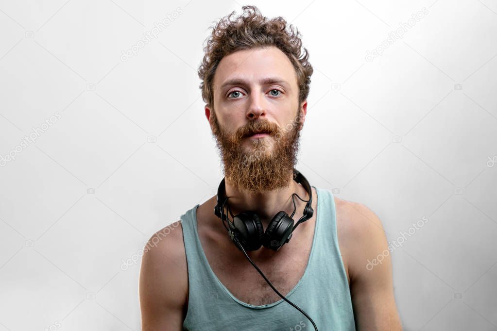 Satisfied cheerful handsome man smiles at camera isolated over white background.