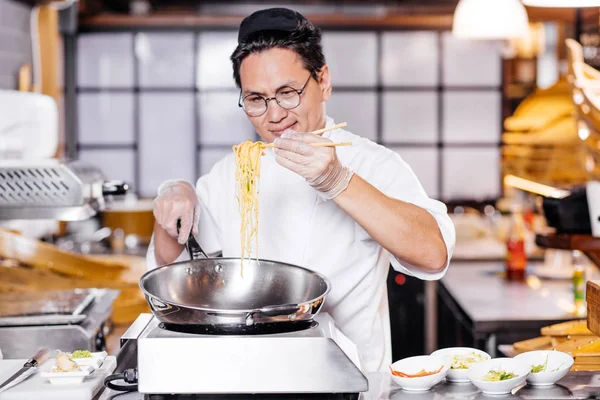 talented man teaching to prepeare Chinese noodle