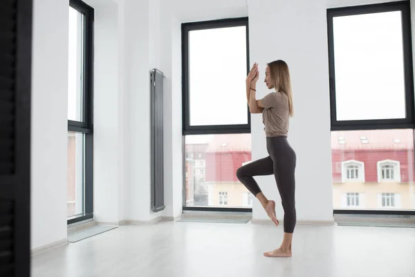 side view full length photo.talented dancer working out in the studio