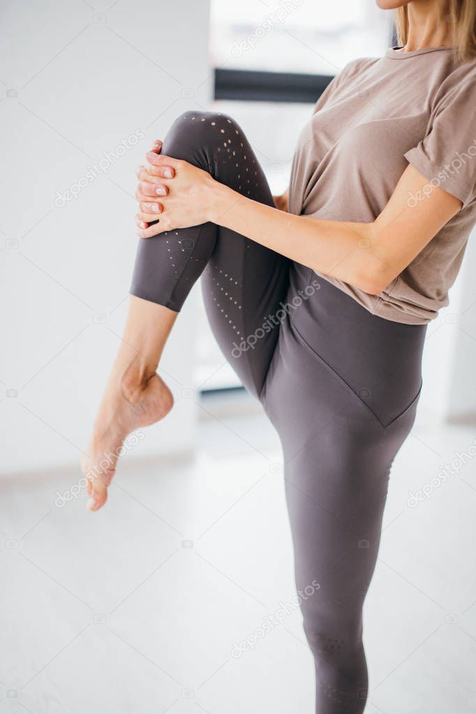 young girl bending her legs and preparing for dancing