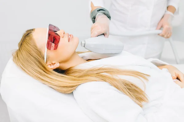 Woman getting laser and ultrasound face treatment in medical spa center — Stock Photo, Image