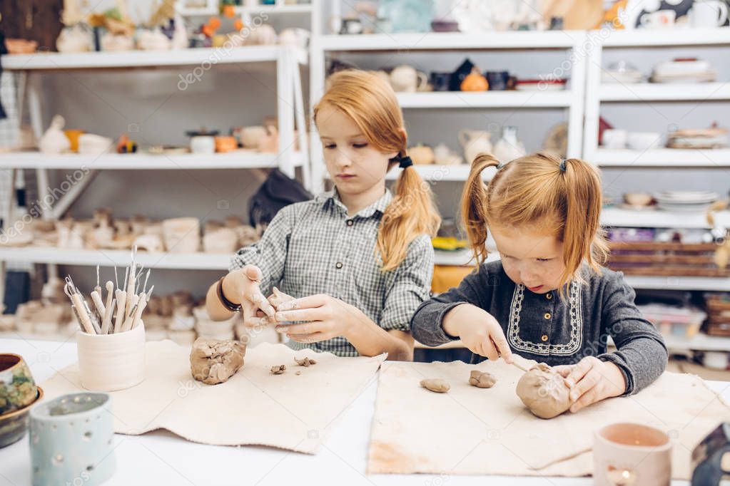 hand-building and sculpting. two sisters are in the Pottery classes