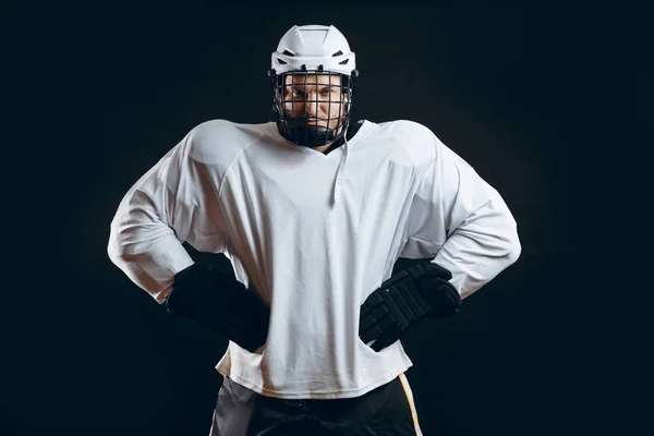 Portrait of ice-hockey player with hockey stick — Stock Photo, Image