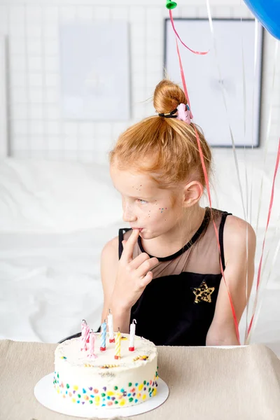 Pensive awesome girl eating a party cake — Stock Photo, Image