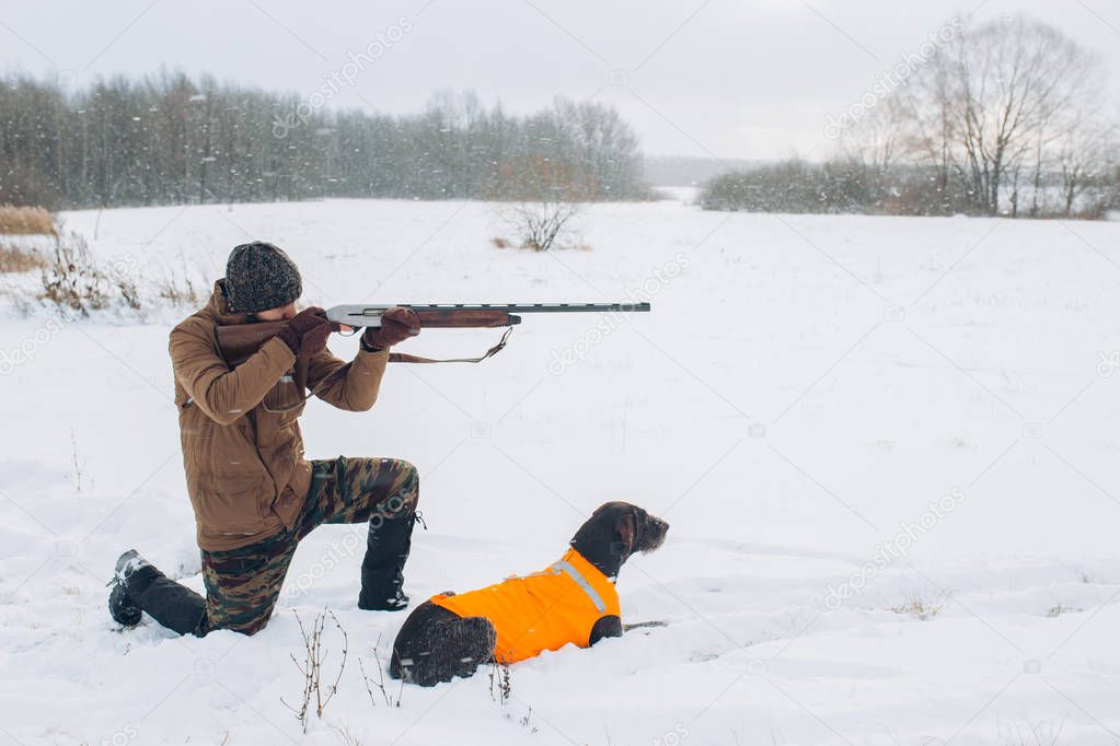 Hunter is goint to shoot at something during the hunting season.