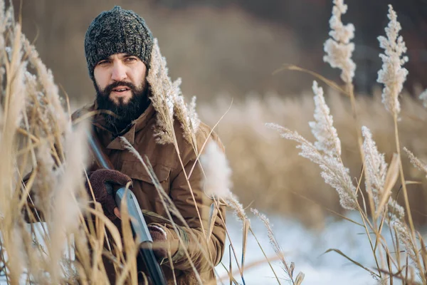 Serious man is watching at birds to kill them — Stock Photo, Image