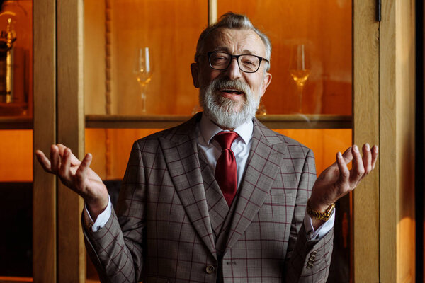 Toned retro styled portrait of businessman sitting in armchair at office