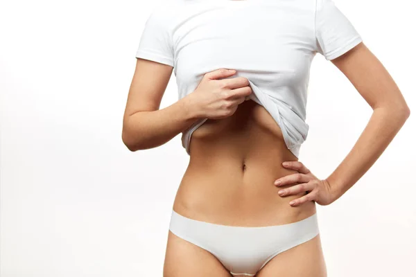 Kobiece zdrowy sprawny szczupły ciało w białe majtki. Dobre trawienie i zdrowie żołądek — Zdjęcie stockowe