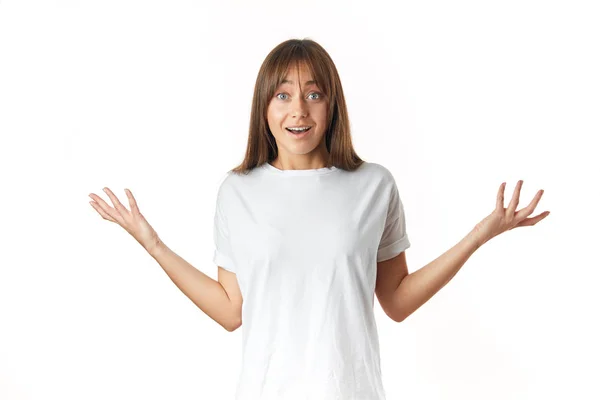 Surpreendido positivo menina mostrando palmas olhando isolado sobre fundo branco — Fotografia de Stock