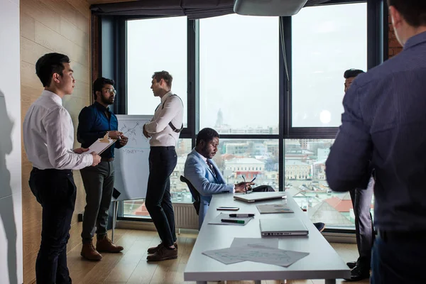 Business people in an open space office with a panoramic window, long shot — Stock Photo, Image