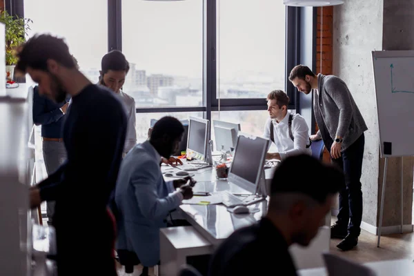 Business people in an open space office interior with a panoramic window — Stock Photo, Image